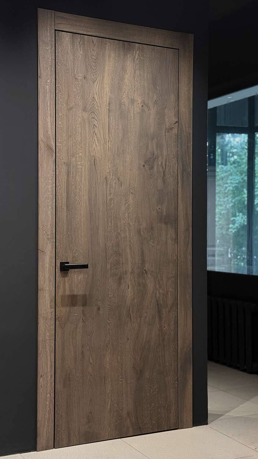 Smoked oak door by a window